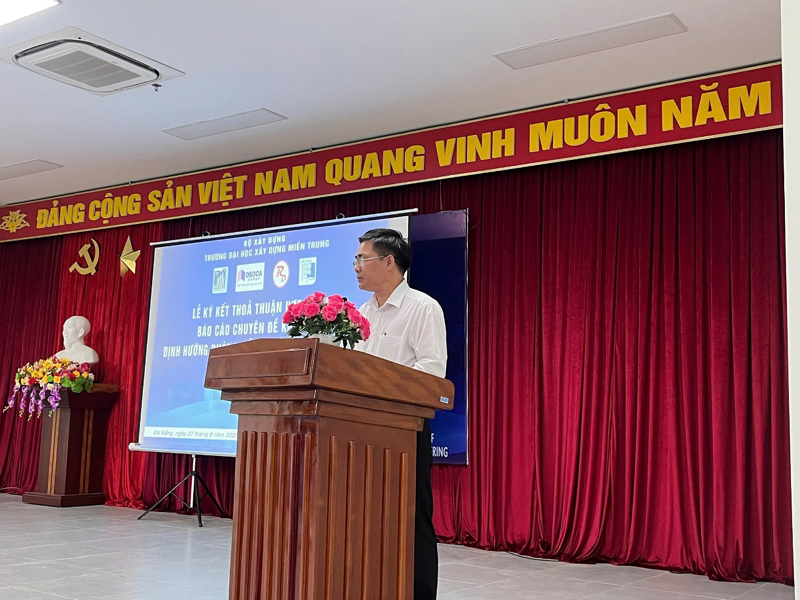 A person standing at a podiumDescription automatically generated