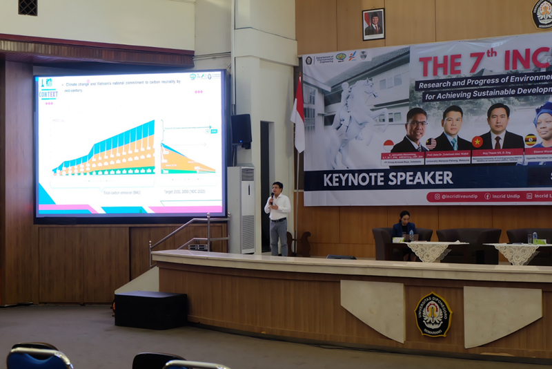 A person standing in front of a large screenAI-generated content may be incorrect.